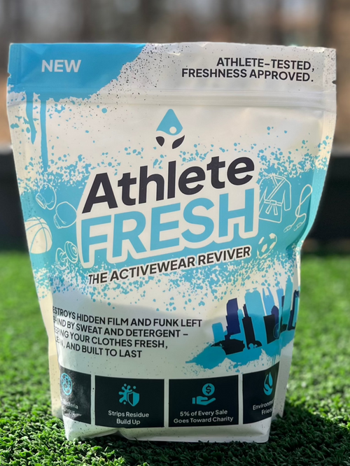 Athlete Fresh product packaging on grass with blurred background